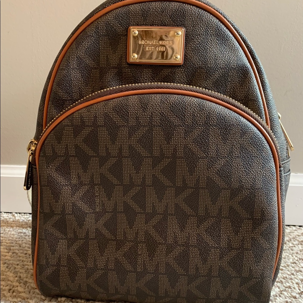 Michael Kors Brown Monogram Backpack.